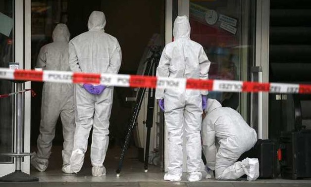 Police investigators work at the crime scene after a knife attack in a supermarket in Hamburg, Germany, July 28, 2017. REUTERS/Morris Mac Matzen

