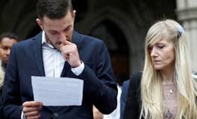 FILE PHOTO Charlie Gard's parents Connie Yates and Chris Gard read a statement at the High Court after a hearing on their baby's future, in London, Britain July 24, 2017.
