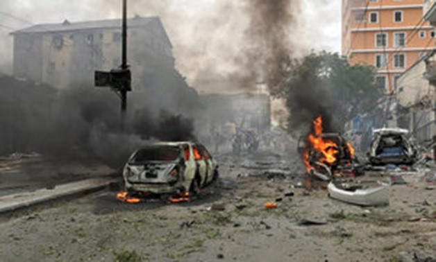 Vehicles burn at the scene of an explosion in Mogadishu, Somalia, July 30, 2017. REUTERS/Feisal Omar

