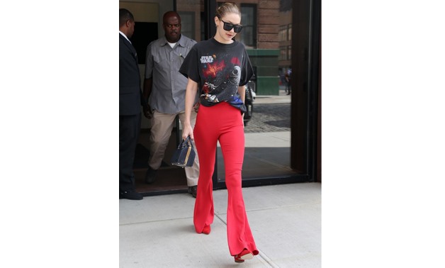 Gigi Hadid wearing semsem’s red pants (courtesy of Backgrid)