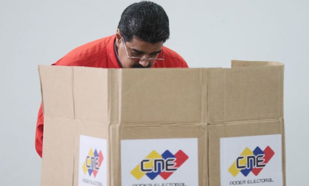 Venezuelan President Nicolas Maduro casting his vote in Caracas on July 30, 2017 Venezuelan President Nicolas Maduro casting - AFP/PRESIDENCIA