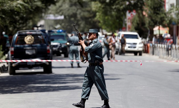 An Afghan police man stands guard at the site of attack in Kabul, Afghanistan July 31, 2017.REUTERS/Mohammad Ismail