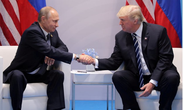 U.S. President Donald Trump shakes hands with Russia's President Vladimir Putin during their bilateral meeting at the G20 summit in Hamburg, Germany July 7, 2017. REUTERS