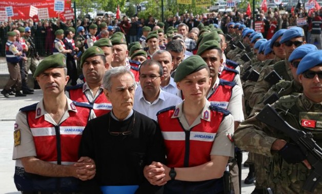 © Adem Altan, AFP | May 23, 2017 file photo shows Turkish Gendarmerie escorting defendants Akin Ozturk (2L) and others involved in last July’s attempted coup in Turkey as they leave the prison where they are being held, ahead of their trial in Ankara.
