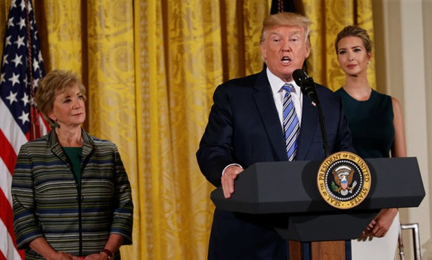 U.S. President Donald Trump is flanked by White House Senior Advisor Ivanka Trump (R) and Small Business Administrator Linda McMahon as he addresses an event with small businesses in the East Room of the White House in Washington, U.S., August 1. 2017. RE