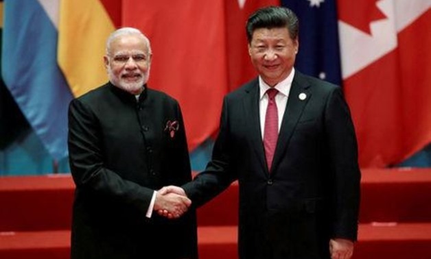 FILE PHOTO: Chinese President Xi Jinping shakes hands with Indian Prime Minister Narendra Modi during the G20 Summit in Hangzhou, Zhejiang province, China September 4, 2016. REUTERS/Damir Sagolj/File Photo
