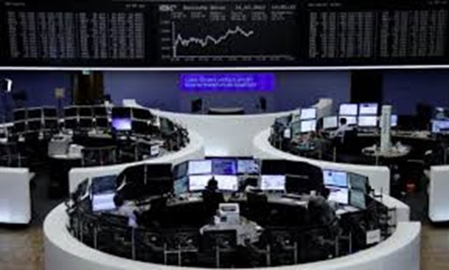 Traders work in front of the German share price index, DAX board, at the stock exchange in Frankfurt, Germany, August 1, 2017.
