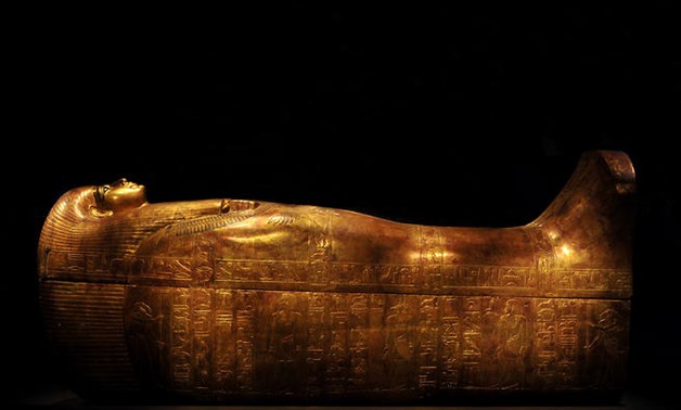 The gilded coffin of Tjuya is displayed at the Melbourne Museum. (AAP/Julian Smith)