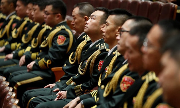 Military band members sit inside the Great Hall of the People during the ceremony to mark the 90th anniversary of the founding of the China's People's Liberation Army in Beijing, China August 1, 2017. REUTERS