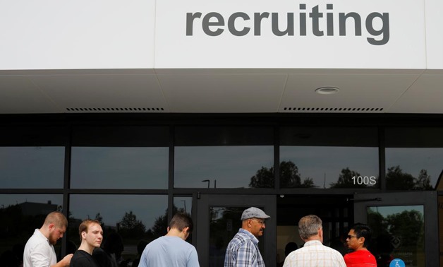 Job seekers line up to apply during "Amazon Jobs Day," a job fair being held at 10 fulfillment centers across the United States aimed at filling more than 50,000 jobs, at the Amazon.com Fulfillment Center in Fall River, Massachusetts, U.S., August 2, 2017