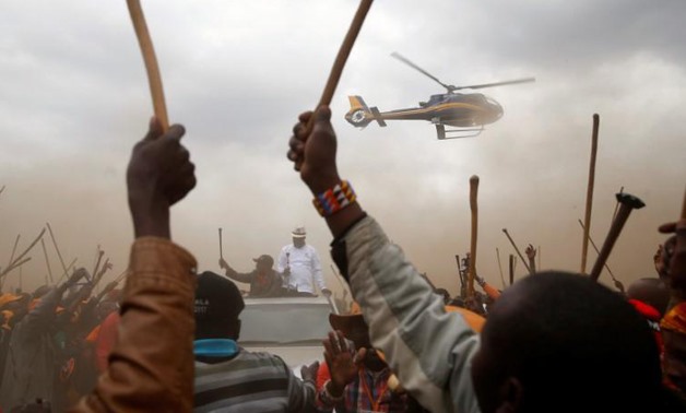 Kenyan opposition leader Raila Odinga, the presidential candidate of the National Super Alliance (NASA )party, is surrounded by supporters from the Maasai community as he arrives on top of a car to an election rally in Suswa, Kenya.
Baz Ratner