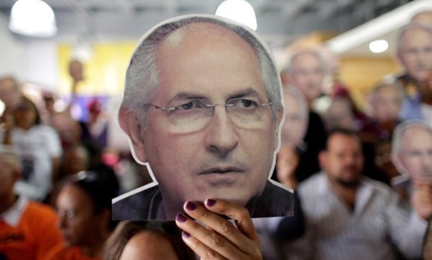 People hold portraits of opposition leader Antonio Ledezma during a news conference at the Venezuelan coalition of opposition parties headquarters in Caracas.
Ueslei Marcelino