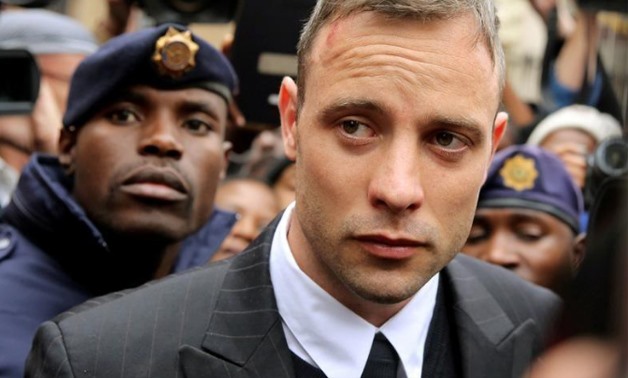 Olympic and Paralympic track star Oscar Pistorius leaves court after appearing for the 2013 killing of his girlfriend Reeva Steenkamp in the North Gauteng High Court in Pretoria, South Africa, June 14, 2016. - Reuters
