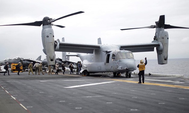 FILE PHOTO: Participants in a ceremony marking the start of Talisman Saber 2017, a biennial joint military exercise between the United States and Australia, board a U.S. Marines MV-22B Osprey Aircraft on the deck of the USS Bonhomme Richard amphibious ass