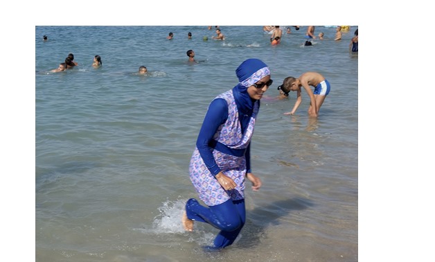 a woman wearing burkini on the beach in Egypt - Archive