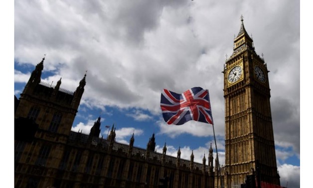 The Union Flag flies near the Houses of Parliament in London - Reuters