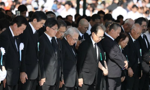 © Jiji Press, AFP | Attendants offer a minute of silence during the 72nd anniversary memorial service for the atomic bomb victims