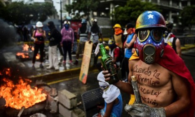 AFP/File | Opposition activists hold a protest against the newly inaugurated Constituent Assembly in Caracas on August 4, 2017