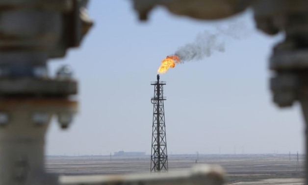Gas burns off at the al-Shuaiba oil refinery in southwest Basra, Iraq April 20, 2017.