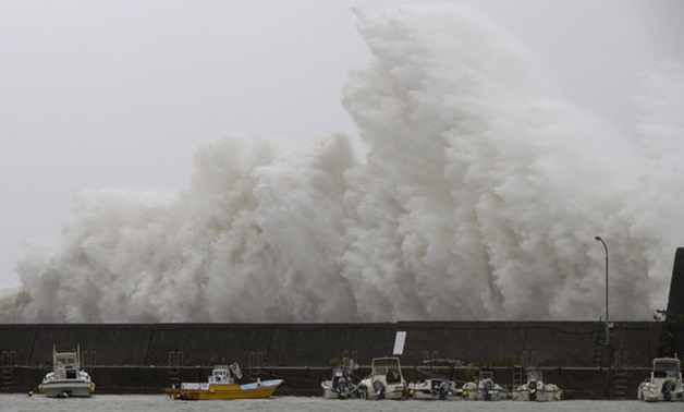 A big wave caused by Typhoon Noru crashes on a breakwater in Aki, Kochi Prefecture, Japan in this photo taken by Kyodo on August 7, 2017. Mandatory credit Kyodo via REUTERS ATTENTION EDITORS - THIS IMAGE WAS PROVIDED BY A THIRD PARTY. MANDATORY CREDIT. JA