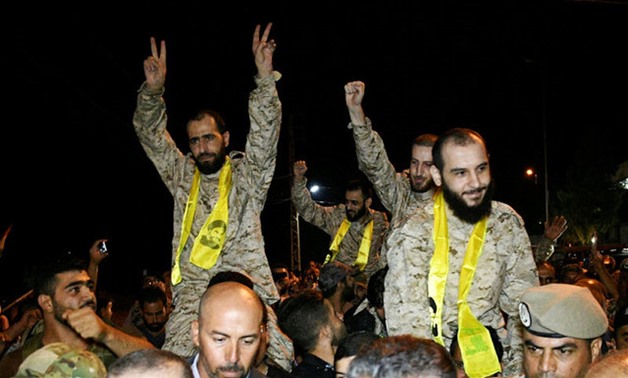 Hezbollah members celebrate in Qaa, Lebanon, after being released by Nusra Front, August 3, 2017. REUTERS
