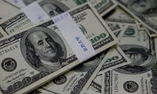 FILE PHOTO: U.S. one hundred dollar bills are seen in this picture illustration, August 2, 2013.
Kim Hong-Ji/Illustration/File Photo