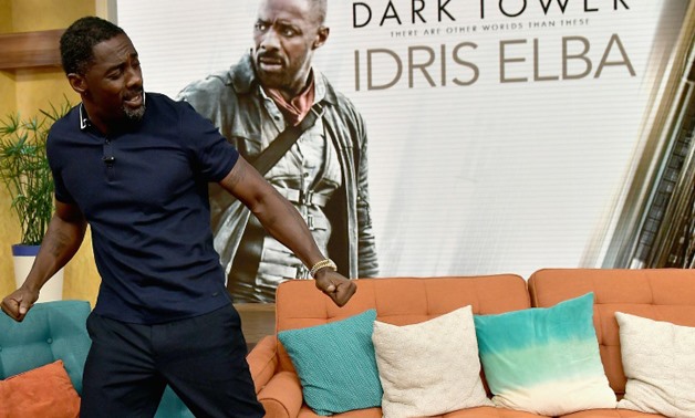 Actor Idris Elba, seen here in a promotional appearance, is the star of "The Dark Towers" which topped the North American box office in its opening weekend - GETTY/AFP/File / Gustavo Caballero