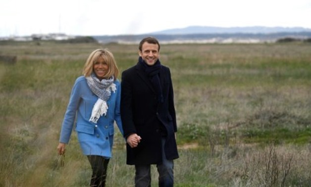 © AFP/File | The focus on the First Lady proposition comes at a bad time for Macron as polls show his popularity slipping badly
