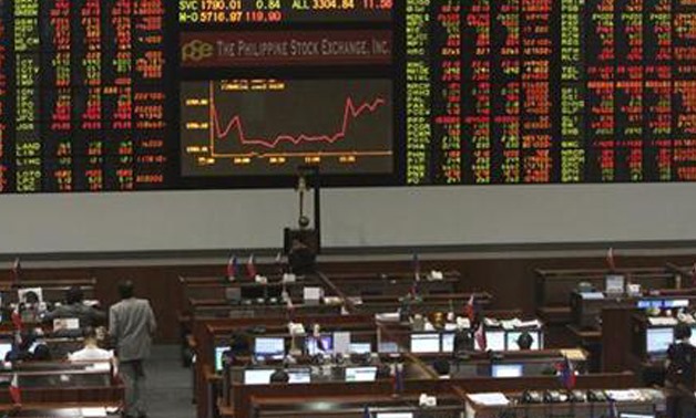 A screen displaying market data is seen inside the Philippine Stock Exchange in Manila's Makati financial district February 21, 2012.
Romeo Ranoco