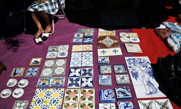 Tiles, part of the Portuguese architectural heritage, are being stolen from public spaces and buildings and sold in markets for low prices to tourists -AFP