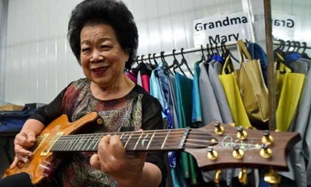 © AFP | Eighty-one-year-old Singapore granny Mary Ho has recorded her own album of Latin music, is often in demand for charity gigs and a video of her playing rock classic 'Need Your Love So Bad' has more than 1.1 million views on YouTube
