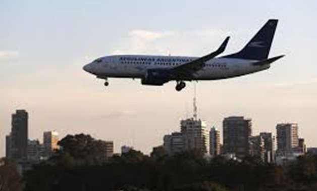 A Boeing 737-700 aircraft belonging to state-run Aerolineas Argentinas lands at Buenos Aires' domestic airport, August 10, 2014.