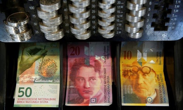 The new 50 Swiss Franc note is seen at a market stall after its release by the Swiss National Bank (SNB) in Bern, Switzerland April 12, 2016 - REUTERS