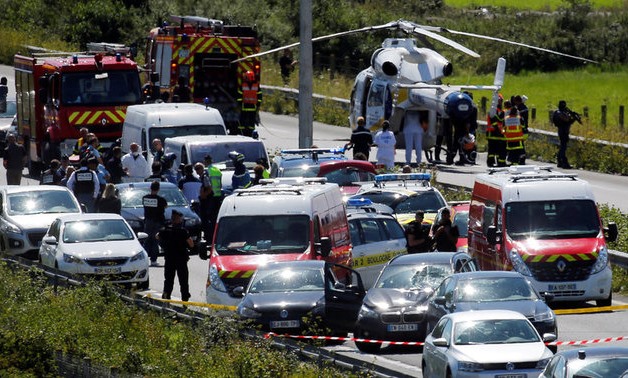 Police and rescue forces are seen on the scene where the man suspected of ramming a car into a group of soldiers on Wednesday in the Paris suburb of Levallois-Perret was shot and arrested on the A16 motorway, near Marquise, France, August 9, 2017. REUTERS