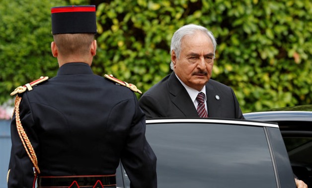 General Khalifa Haftar, commander in the Libyan National Army (LNA), arrives to attend a meeting for talks over a political deal to help end Libya’s crisis in La Celle-Saint-Cloud near Paris, France, July 25, 2017. REUTERS/Philippe Wojazer