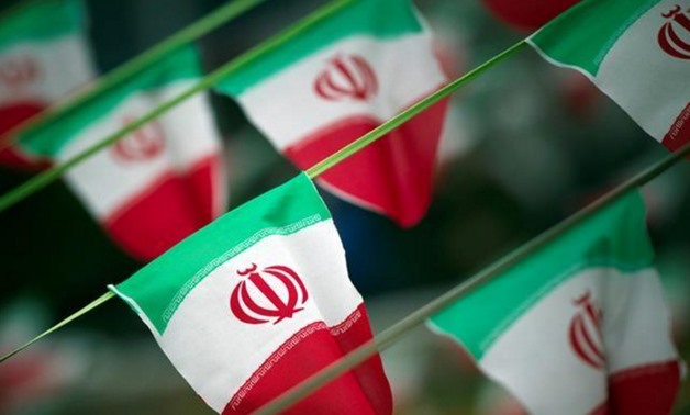 Iran's national flags are seen on a square in Tehran - Reuters