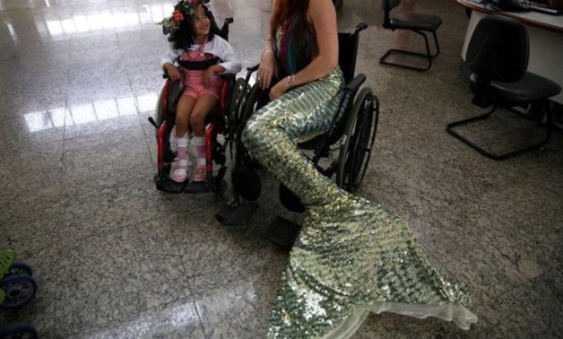 Mermaid and diving instructor Luciana Fuzetti trains whilst wearing a mermaid tail in the Tijucas Islands in Rio de Janeiro, Brazil July 22, 2017 – Reuters 