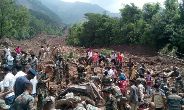 © AFP / by Paavan MATHEMA | Rescuers look for survivors at the site of a landslide in Himachal Pradesh, northern India
