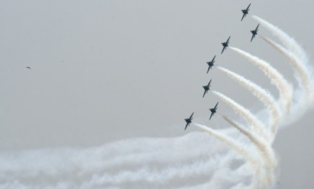 © AFP/File | An aerobatics team performs a rehearsal before Pakistan's Independence Day celebrations