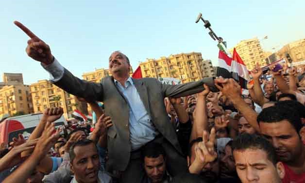 Brotherhood leader Mohamed el-Beltagy shouting slogans with protesters in Tahrir square- Reuters