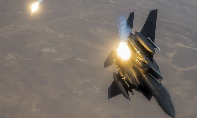An Air Force F-15E Strike Eagle fires flares during a flight supporting Operation Inherent Resolve, June 21, 2017. Air Force photo by Staff Sgt. Trevor T. McBride
