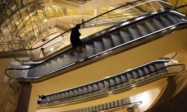 FILE PHOTO - A customer uses the escalators in the Limbecker Platz shopping mall in Essen, Germany, December 2, 2008.
Ina Fassbender/File Photo