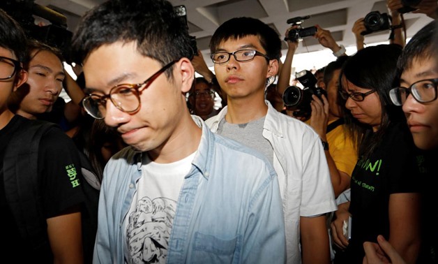 Student leaders Nathan Law and Joshua Wong walk into the High Court to face verdict on charges relating to the 2014 pro-democracy Umbrella Movement, also known as Occupy Central protests, in Hong Kong, China August 17, 2017.
Tyrone Siu