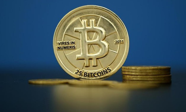 Bitcoin (virtual currency) coins are seen in an illustration picture taken at La Maison du Bitcoin in Paris, France, May 27, 2015. REUTERS