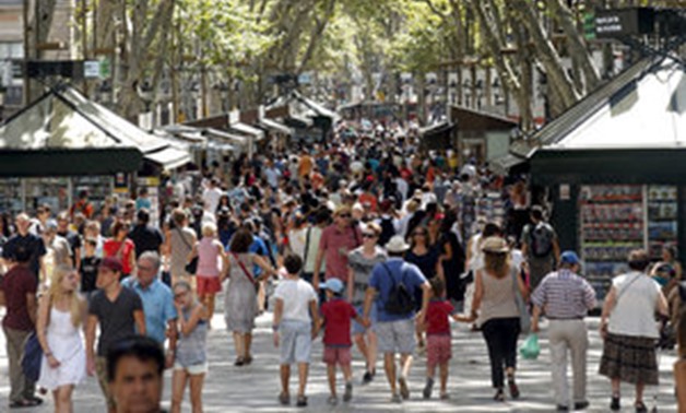 People walk by Las Ramblas in Barcelona  - REUTERS