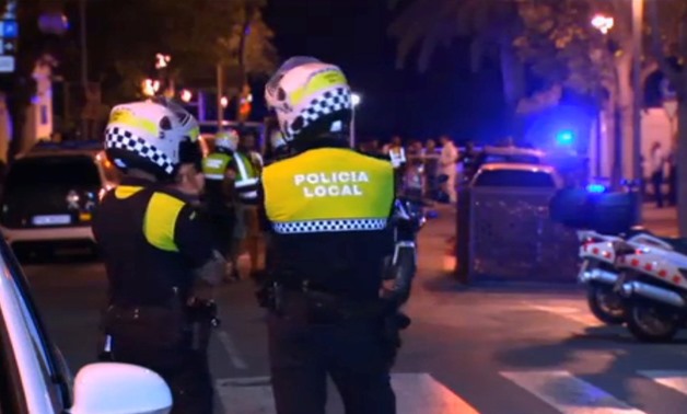 Officers investigate at the scene where police had killed four attackers in Cambrils, south of Barcelona, in this still image taken from Reuters video on August 18, 2017 - REUTERS 
