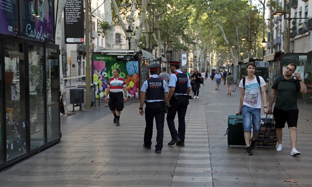 Catalan Mossos d'esquadra officers patrol at Las Ramblas street where a van crashed into pedestrians in Barcelona, Spain August 18, 2017 - REUTERS