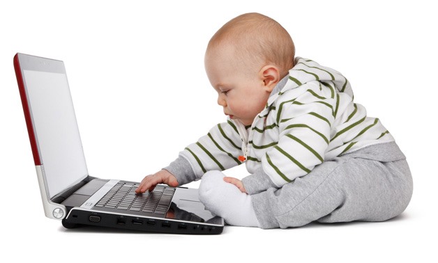 Baby working on a laptop - Courtesy of Public domain pictures/Petr Kratochvil 