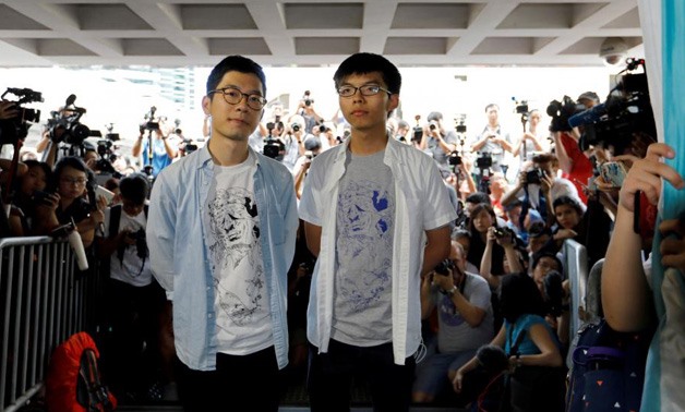 Student leaders Nathan Law and Joshua Wong arrive at the High Court to face verdict on charges relating to the 2014 pro-democracy Umbrella Movement, also known as Occupy Central protests, in Hong Kong, China.
Tyrone Siu