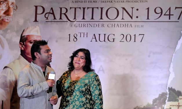 This file photo taken on July 4, 2017 shows Indian film score composer and singer AR Rahman (L) taking part in a promotional event for the forthcoming Hindi film 'Partition 1947' directed by Gurinder Chadha (R) in Mumbai - AFP/File / STR